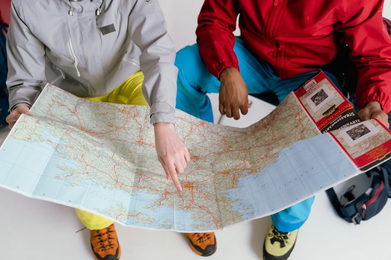 Travel planning materials arranged for an upcoming journey